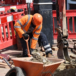 A civils engineer completing work on a road.